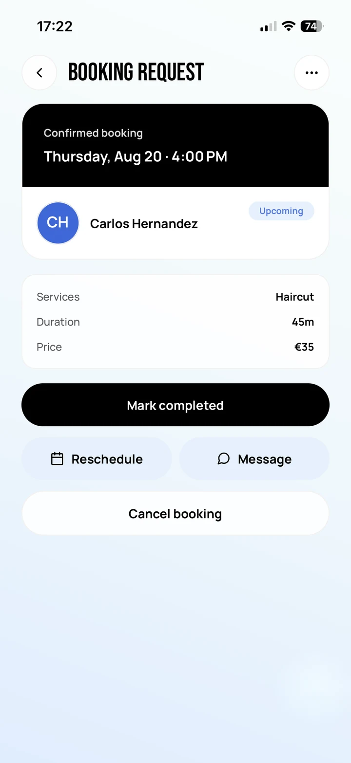 Empire Biz: the confirmed booking with Mark completed, above Reschedule, Message and Cancel booking