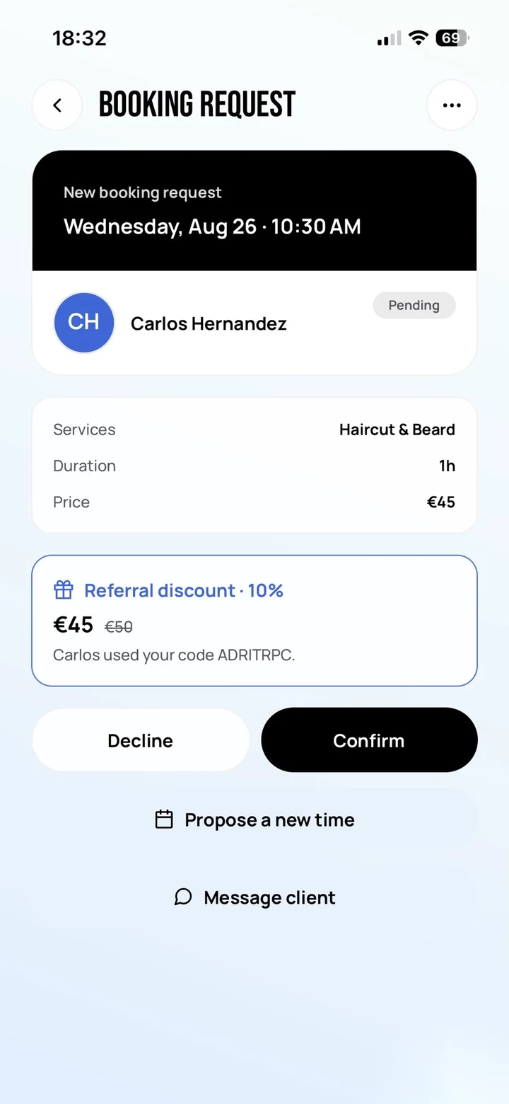Empire Biz: the incoming booking request with a highlighted Referral discount panel — ten percent, 45 euros down from 50, and a line reading that Carlos used your code ADRITRPC