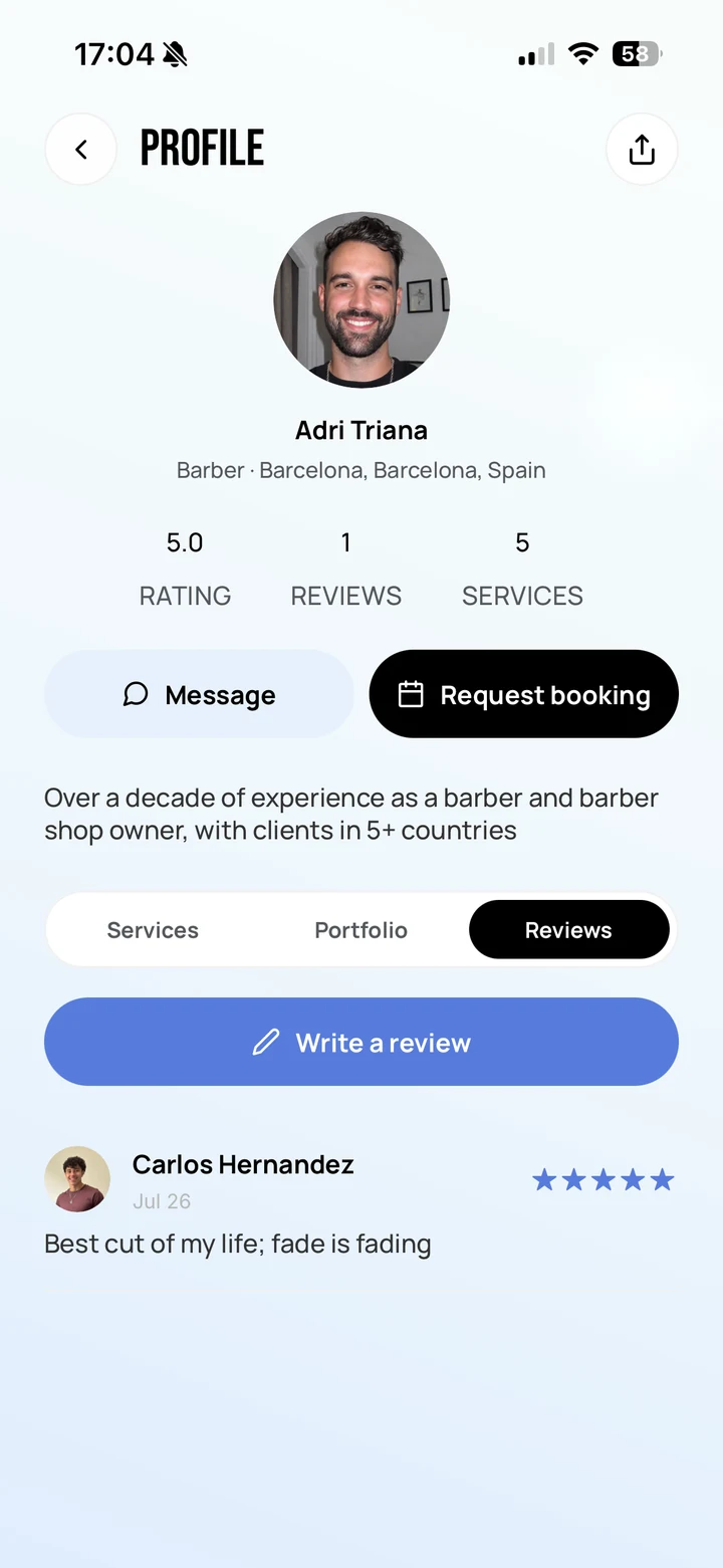 Empire Client: the Reviews tab on a barber profile, with a Write a review action and a five-star review left by a client