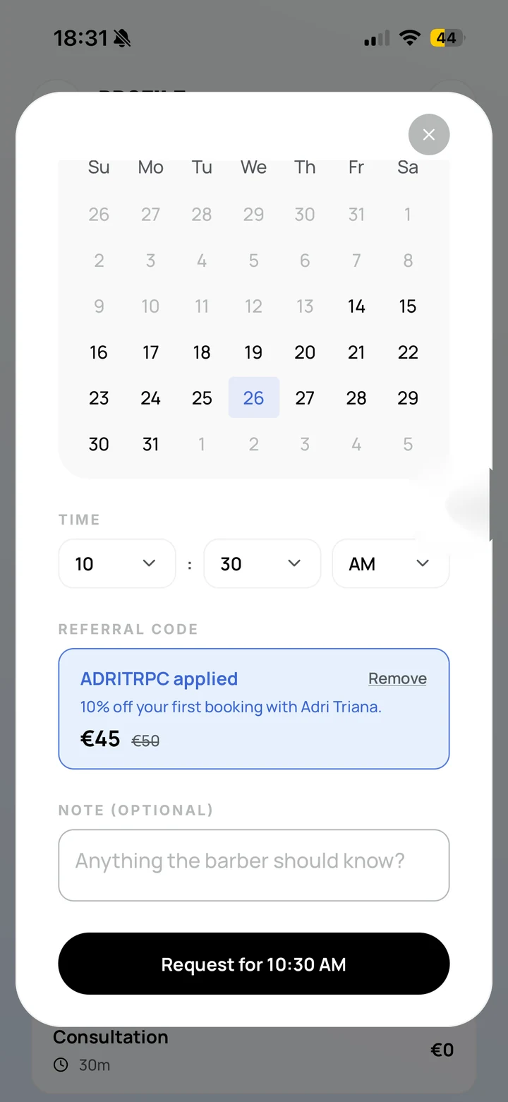 Empire Client: the booking sheet with a referral code applied — ADRITRPC, ten percent off the first booking with this barber, the price struck through from 50 to 45 euros, with a Remove action